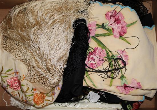 A black multi-coloured shawl, a cream embroidered shawl, another and a black lace stole